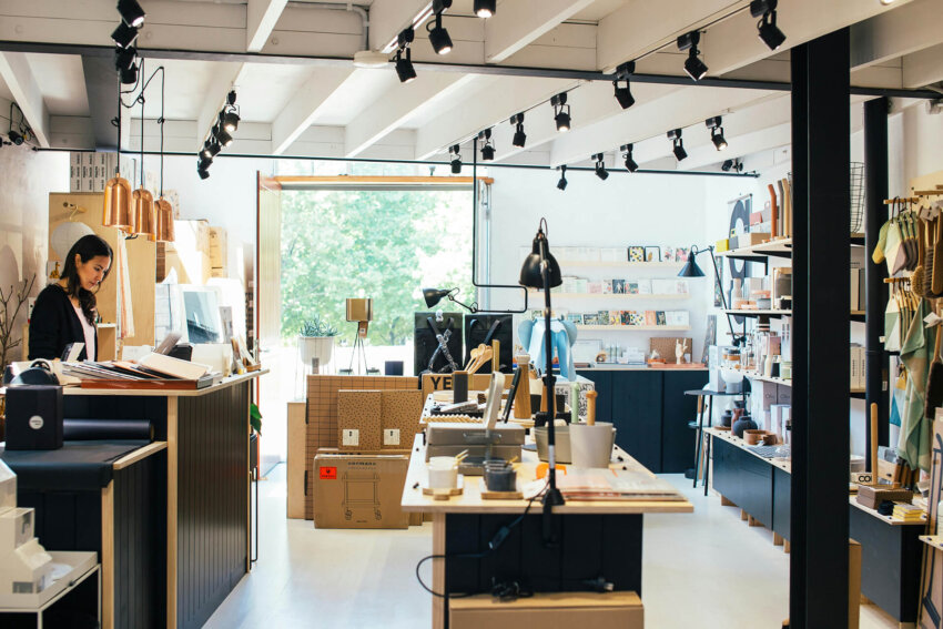 Modern retail store interior with track lighting and designer home goods display